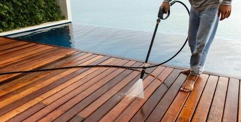 power cleaning wooden ocean view deck